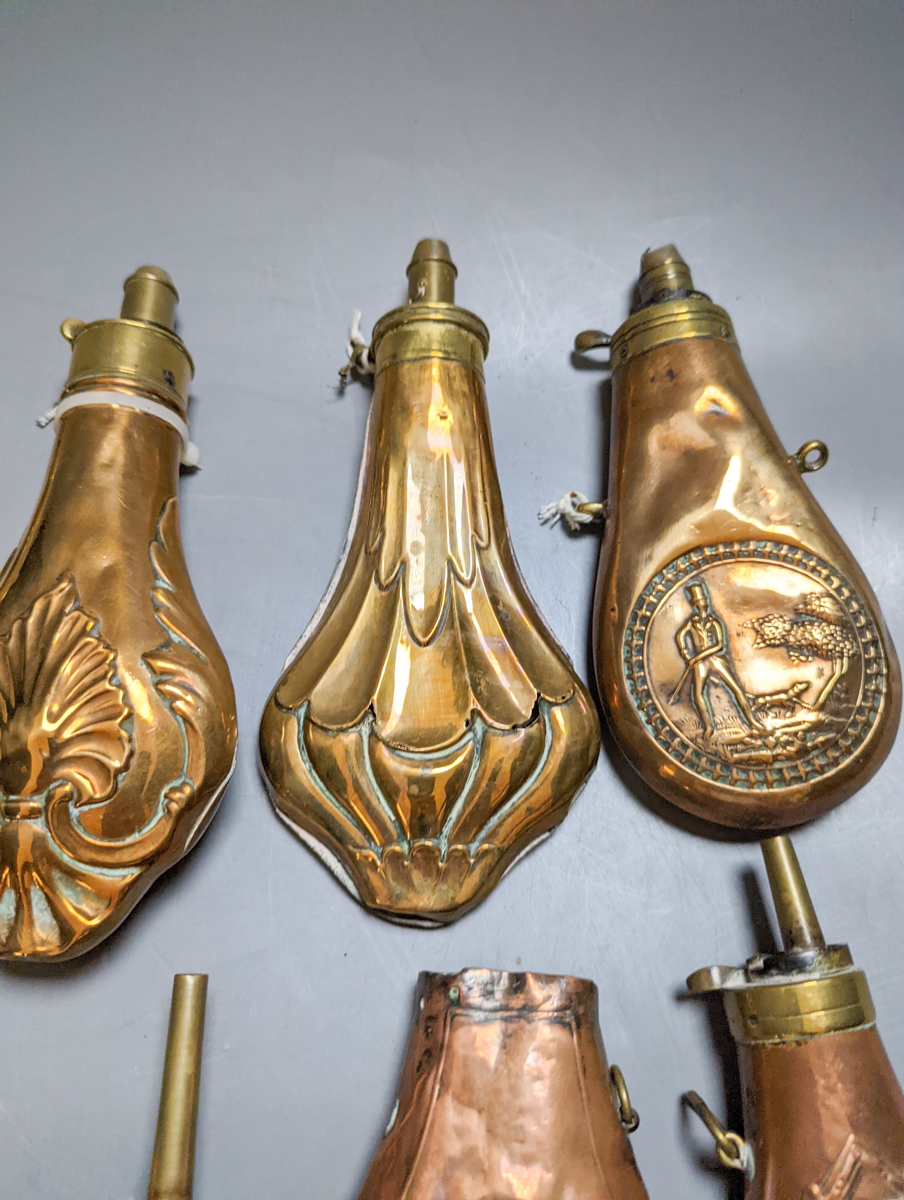 Eight assorted 19th century copper shot flasks